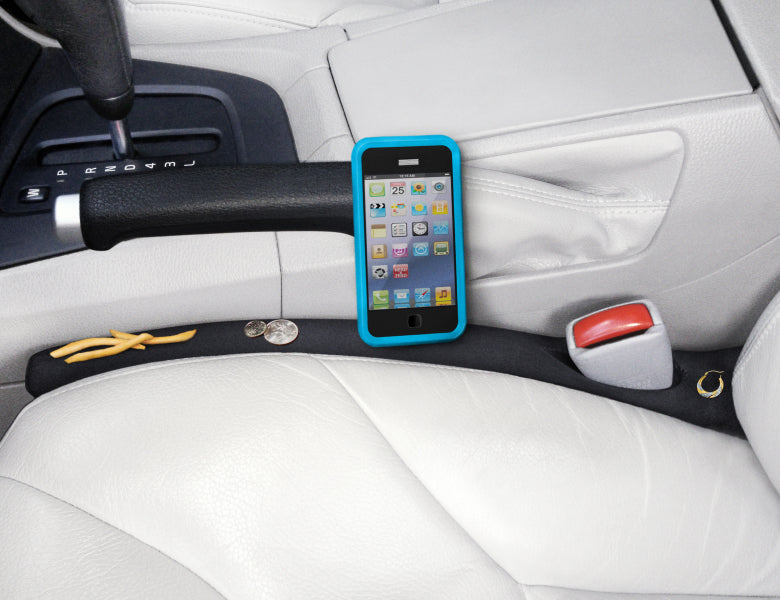 Drop Stop Car Seat Gap Filler protecting a phone, jewelry, french fries and change from drop down the car seat gap.